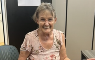 woman in glasses smiling